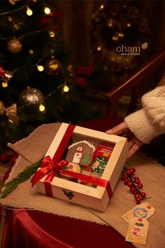 a small wooden box with christmas decorations inside