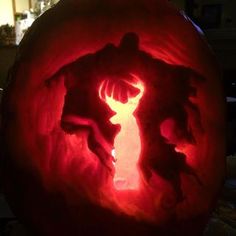 a carved pumpkin with an image of a person on it