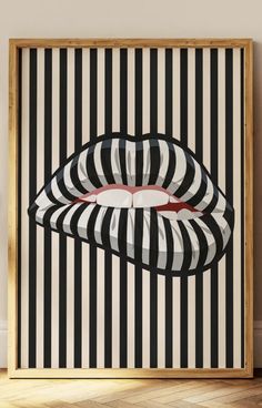 a black and white striped poster with a red lip on it's lips in the middle