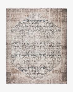 an old rug with faded colors and patterns on the bottom, in greys and beiges