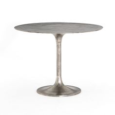 an aluminum table with a round top on a white background in the shape of a tulip