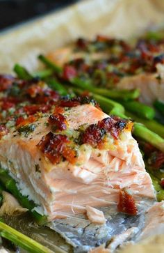 salmon and asparagus on a plate with seasoning