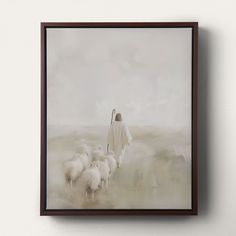 a painting of jesus walking with his sheep