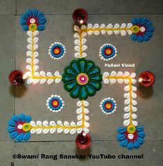 a decorated floor with candles and flowers on it for diwaling or decorating