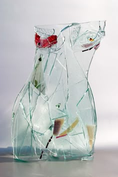 a broken glass vase sitting on top of a table