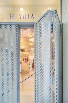 the entrance to an office building with perfored doors