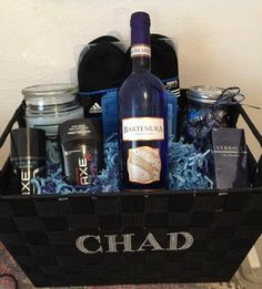 a bottle of wine sitting in a basket filled with personal care products and other items