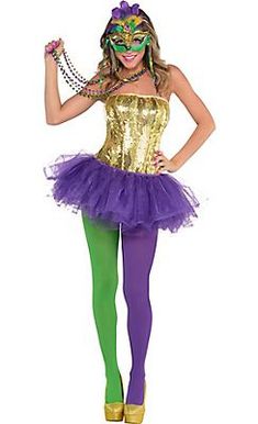 a woman dressed in a costume that is gold and purple with green leggings