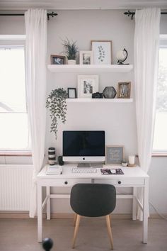 a white desk with a computer on top of it