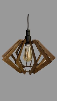 a wooden light fixture hanging from the ceiling