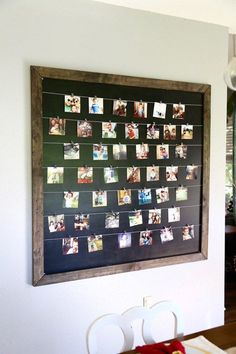 a blackboard with pictures hanging on it and the words diy photo display below