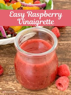 raspberry vinaigrette in a jar next to a salad