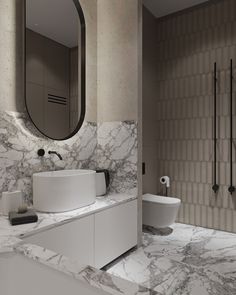 a bathroom with marble counter tops and walls