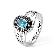 a ring with an oval blue stone on the center and words written in white gold