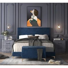 a bedroom with gray walls and blue bedding, artwork on the wall above it