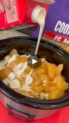 a crock pot filled with food sitting on top of a table