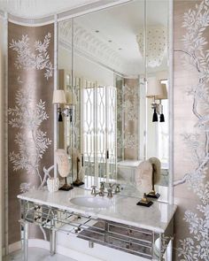 a large mirror sitting on top of a white counter