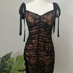 For Love And Lemons Only Worn Once And In Perfect Condition! Size L Color: Black And Nude The Perfect Balance Between Sweet And Sleek. The Dolly Mini Dress Features Pleated Lace, Satin Shoulder Straps, A Ruffled Scalloped Hemline And Decorative Center Front Buttons. Adjustable Black Satin Shoulder Tie Straps. Invisible Center Back Zipper. Fully Lined. Black Flirty Dress With Sweetheart Neckline, Black Summer Corset Dress In Flirty Style, Black Flirty Corset Dress For Date Night, Flirty Black Corset Dress For Date Night, Black Lace Party Dress With Sweetheart Neckline, Fitted Flirty Lace Dress For Date Night, Party Corset Dress With Lace Trim And Mini Length, Evening Mini Dress With Lace Trim, Coquette Lace Trim Dress For Night Out