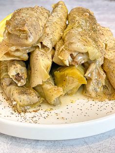 some food on a white plate with seasoning