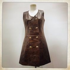 BROWN LEATHER MOD Description: Chic Vintage 60s Mid Century Mod Shift Cocktail GO-GO Dress. Brown Leather. 8 Ornate Gold Turn Lock Clasp Closures. Mid Century Mod. Serious 60s 70s Fashion. Excellent Worn Vintage Condition. BROWN LEATHER A-GO-GO! Flat Measurements: Size - Small/Medium. Bust: (Armpit to Armpit) - 17" Across (34" Total). Waist: 16.5" Across (33" Total). Hips: (Seam to Seam) - 20" Across (40" Total). Length - 34" (Top of Dress to Bottom Hem). For best fit, please compare measurements with a dress of your own. Go Go Dress, 70s Mode, Vintage 60s Dress, Gogo Dress, 60s 70s Fashion, Vintage Dress 60s, Mid Century Mod, 60s Dress, Graduation Outfit