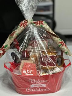 a red basket filled with lots of holiday treats