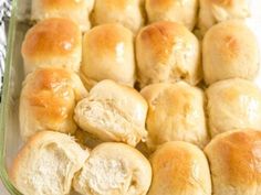 rolls in a glass baking dish with butter on top