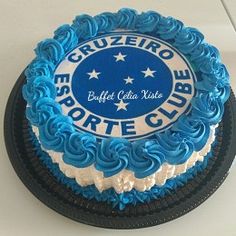 a blue and white cake sitting on top of a counter