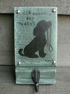 a metal hook with a dog on it