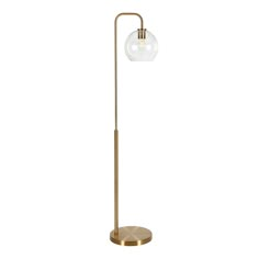 a brass floor lamp with a glass ball on the top and a metal pole at the base