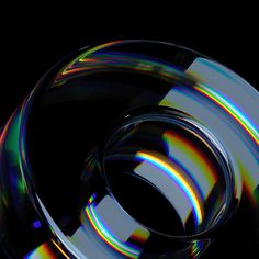 an abstract image of a circular object on a black background with multicolored lines