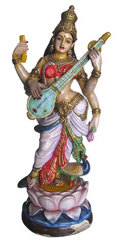 a statue of a woman playing a guitar