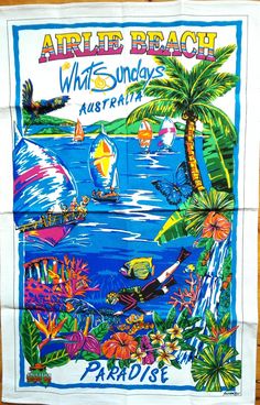 an advertisement for the airlie beach whits and sandy australia program on a wooden table