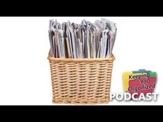 a wicker basket filled with newspapers next to a sign that reads keeping your organized