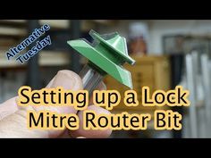 a hand holding a metal tool with the words setting up a lock mitre router bit