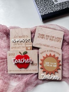 three wooden magnets with teacher's day sayings and an apple on them