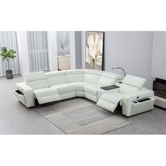 a living room with a white sectional couch