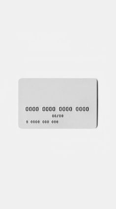 a white credit card sitting on top of a table