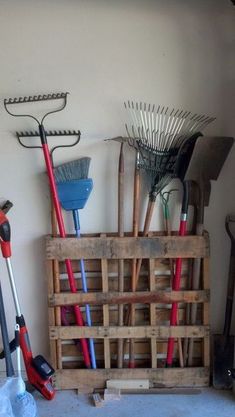 a wooden crate filled with lots of tools