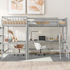 a loft bed with desk and chair in the corner next to a painting on the wall