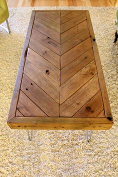 a wooden bench sitting on top of a carpeted floor