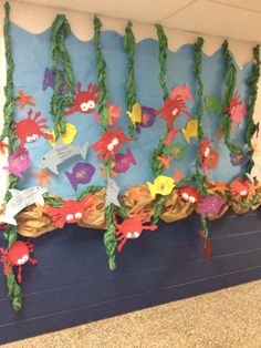 a bulletin board with sea animals on it and under the ocean theme, along with other decorations