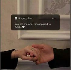 two people holding hands in front of a window with the caption'you are the one, i most asked to allah '