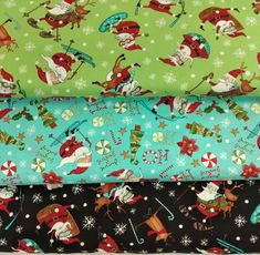 four different christmas fabrics with santa claus and snowmen on green, black, and blue