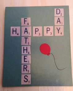 a crossword puzzle with a red balloon attached to the letters happy father's day