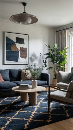 a living room filled with furniture and a painting on the wall