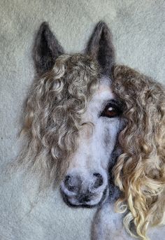 a white horse with blonde curly hair next to a woman's head on a gray background