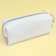 This kawaii pencil case features cute watercolor-like prints of Sanrio Characters dressed as babies! It even showcases a sheer ribbon zipper pull for added cuteness. Use this case to store your writing materials. Made from synthetic leather Cute White Pencil Case With Pen Holders, Cute White Pencil Case For Daily Use, Cute Portable White Pencil Case, White Portable Kawaii Pencil Case, Portable White Stationery, Kawaii White Pencil Case With Pen Slots, Cute White Rectangular Pencil Case, White Portable Pencil Cosmetic Bag, White Pencil Case Pouch For School