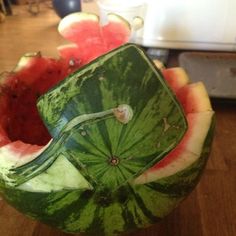 a watermelon that has been cut in half and is sitting on a table