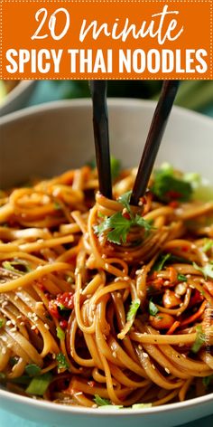 a bowl full of noodles with chopsticks in it and the title overlay reads 20 minute spicy thai noodles