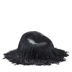 a black hat with long hair on the top and one side is made out of fur